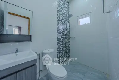 Modern bathroom with sleek design and stylish tile accents