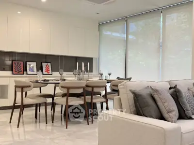 Modern living room with elegant dining area and stylish decor