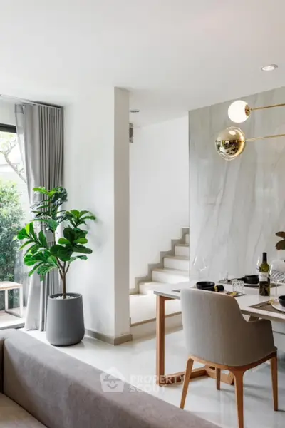 Modern open-plan living and dining area with stylish decor and natural light