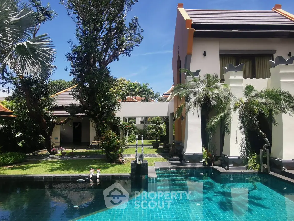 Luxurious villa with private pool and lush garden, perfect for tropical living.