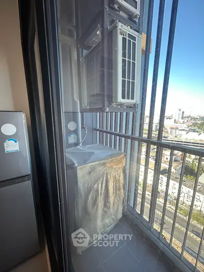 Modern balcony with city view and air conditioning unit, perfect for urban living.