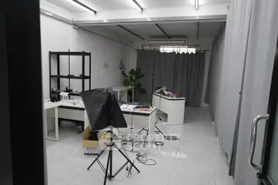 Spacious office space with modern lighting and minimalist furniture setup