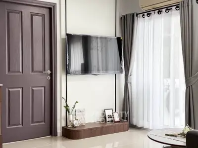 Modern living room with wall-mounted TV and elegant decor