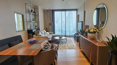 Stylish modern living room with elegant decor and large windows offering natural light.