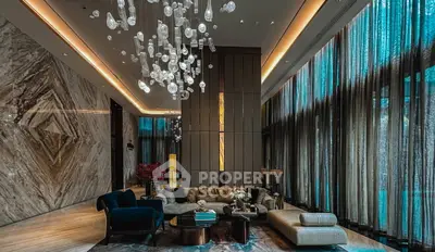 Luxurious living room with elegant chandelier and modern decor