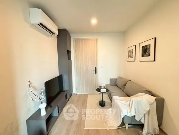 Cozy modern living room with stylish decor and air conditioning