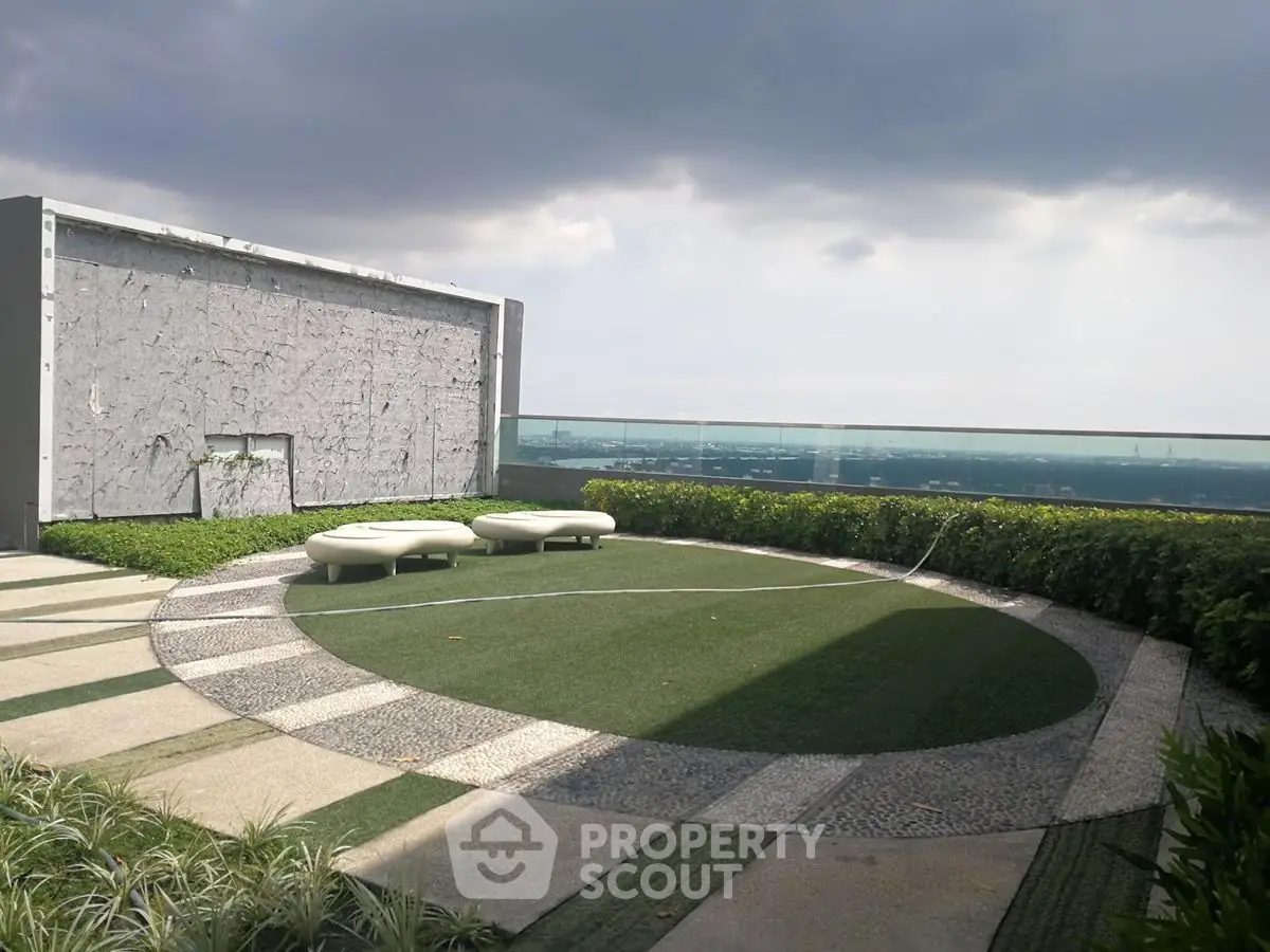 Stunning rooftop garden with panoramic city views and modern seating area.