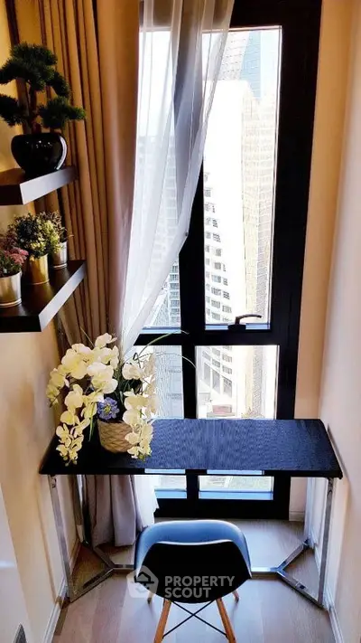 Chic study nook with city view, modern desk, and elegant decor.