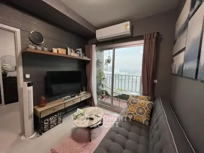 Chic living room with balcony and city view, modern decor and cozy ambiance.
