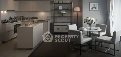 Elegant modern kitchen with dining area, featuring sleek cabinetry and stylish decor.