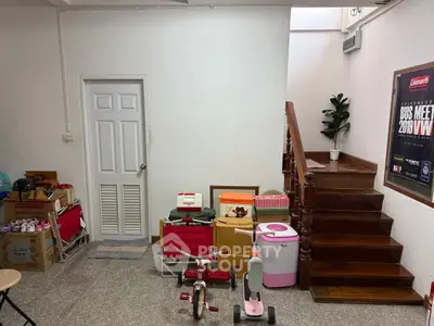 Cozy storage area with staircase and children's toys, perfect for organizing and family activities.