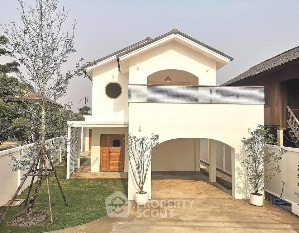 Charming two-story house with spacious balcony and modern design in serene neighborhood.