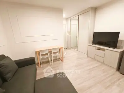 Modern living room with sleek furniture and wooden flooring