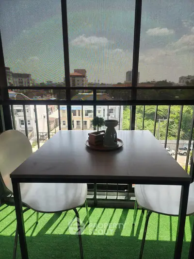 Charming balcony with city view, perfect for relaxing and enjoying the outdoors.