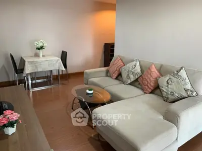 Spacious living room with modern decor and cozy seating area