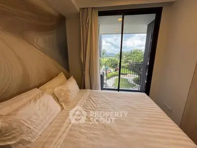 Luxurious bedroom with balcony offering stunning garden views in modern apartment.