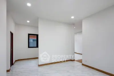 Spacious modern interior with white walls and marble flooring, ideal for customization.