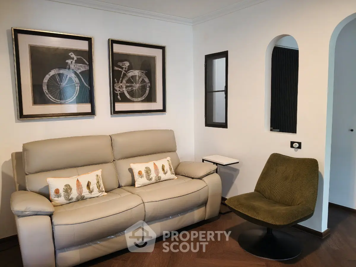Stylish living room with modern sofa, chic artwork, and elegant decor