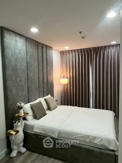 Luxurious bedroom with elegant decor and plush bedding in modern apartment