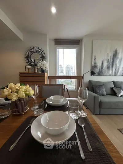 Stylish living room with elegant dining setup and city view, perfect for modern urban living.