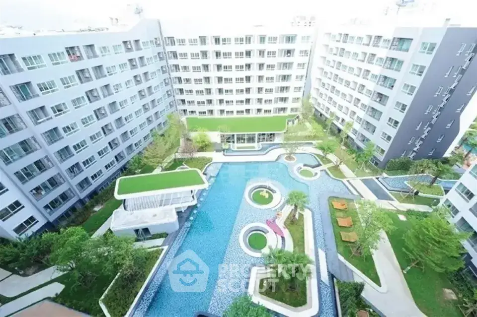 Luxurious apartment complex with stunning pool and lush gardens
