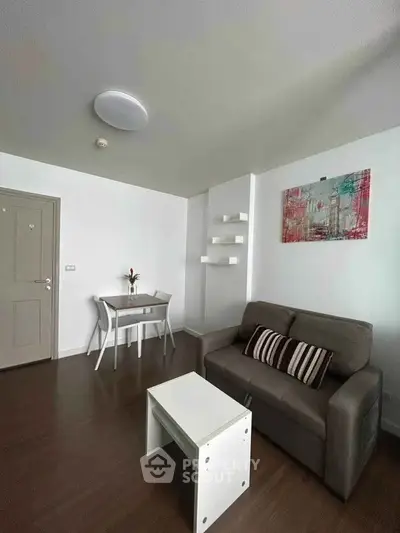 Modern living room with sleek furniture and stylish decor in a cozy apartment.