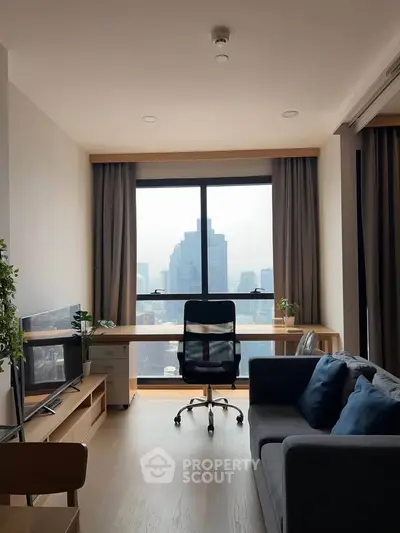 Modern living room with city view, featuring sleek furniture and large window for natural light.