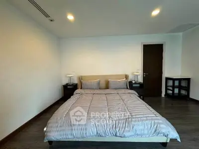Spacious bedroom with modern decor and cozy ambiance