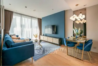 Luxurious modern living room with elegant blue decor and stylish dining area
