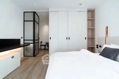 Modern bedroom with sleek design and built-in storage