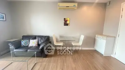 Modern living room with sleek furniture and wooden flooring