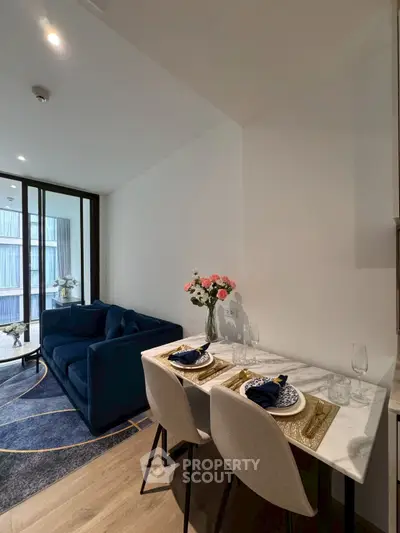 Modern living room with elegant dining area and stylish decor in a contemporary apartment.