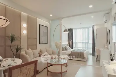 Modern open-plan living room and bedroom with stylish decor and natural light