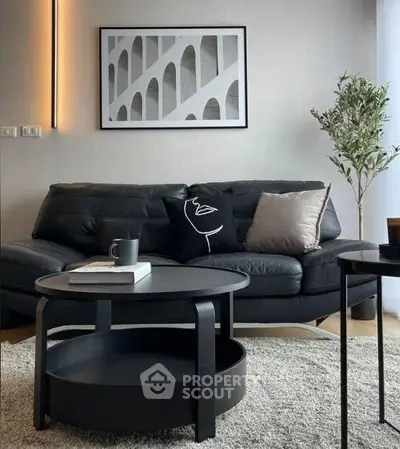 Modern living room with stylish black sofa and chic decor