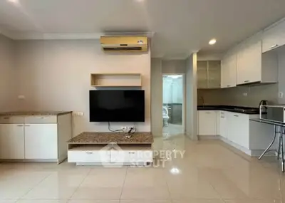 Spacious modern living room with open kitchen and sleek design