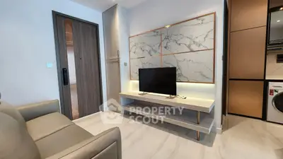 Modern living room with sleek TV stand and marble accent wall