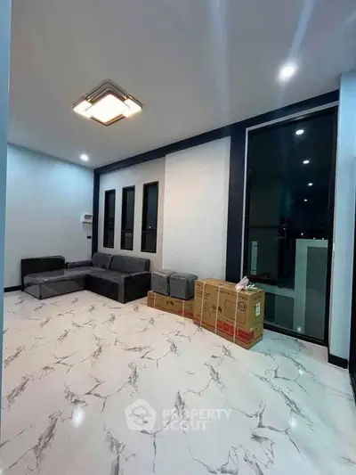 Modern living room with sleek design and marble flooring