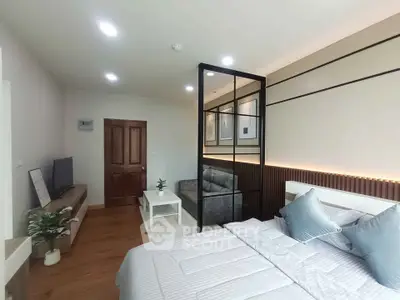 Modern studio apartment with stylish partition and cozy decor