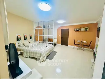 Spacious studio apartment with modern decor and cozy dining area