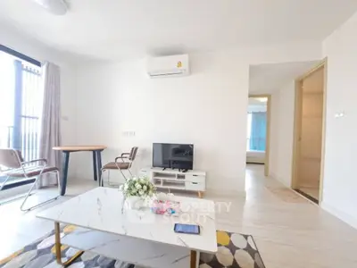 Bright modern living room with air conditioning and stylish furniture