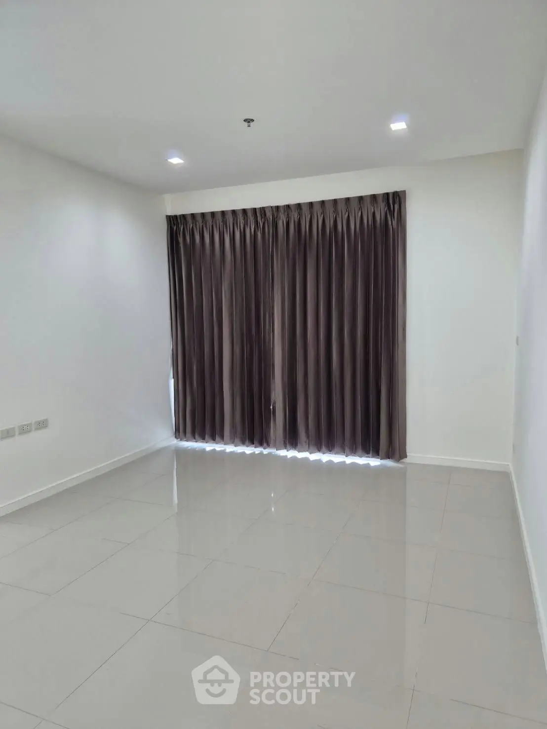 Spacious empty room with elegant curtains and glossy tiled floor, perfect for customization.
