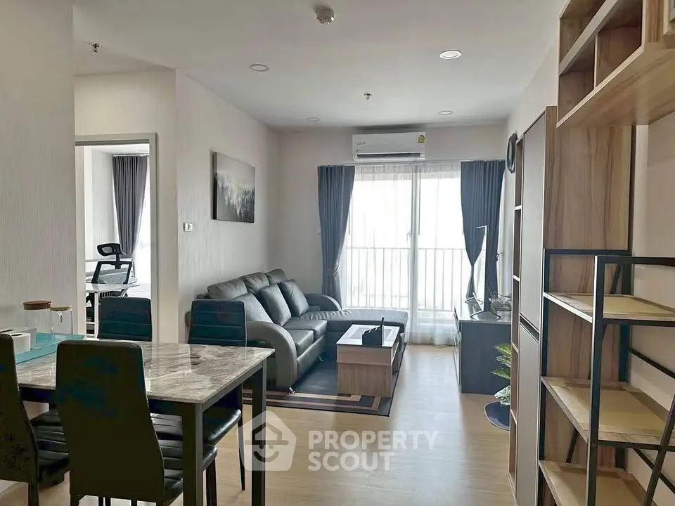 Modern living room with stylish furniture and natural light in a contemporary apartment.