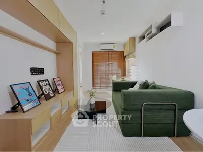 Modern living room with stylish green sofa and wooden accents, perfect for cozy relaxation.