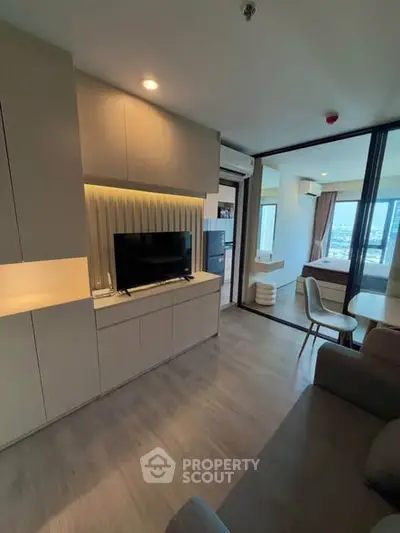 Modern living room with open layout and stylish decor in a contemporary apartment.