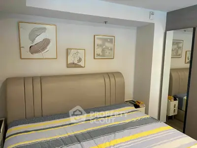 Modern bedroom with stylish decor and comfortable bed in a contemporary apartment.
