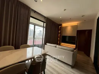 Modern living room with city view, elegant dining area, and cozy lighting.