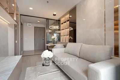 Luxurious modern living room with elegant decor and plush sofa in a high-end apartment.