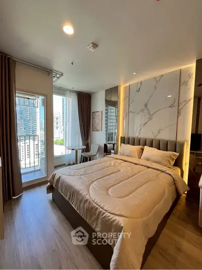 Modern bedroom with large window and stylish decor