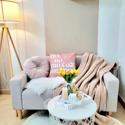 Cozy living room corner with stylish decor and soft lighting