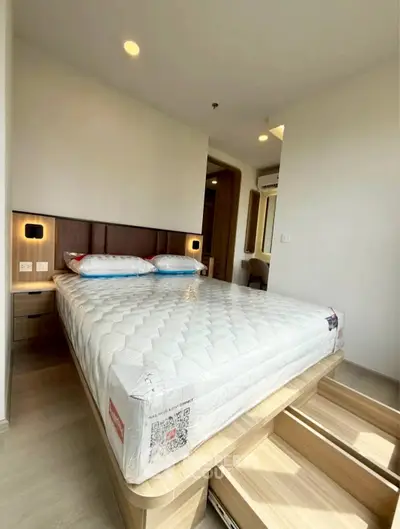 Modern bedroom with built-in storage and stylish lighting